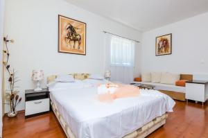 Posteľ alebo postele v izbe v ubytovaní Apartments Villa Aura - Adult Only