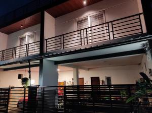 a building with a balcony on top of it at The Beach House in Chennai