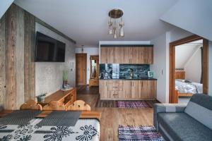 Kuchyňa alebo kuchynka v ubytovaní Willa Pasieka Apartamenty Domki