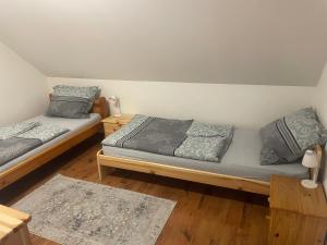 Posteľ alebo postele v izbe v ubytovaní Apartmán Beruška