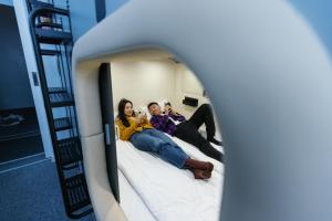 Hostia v ubytovaní Capsule Hotel Constellation 89