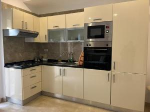 Dapur atau dapur kecil di Studio malaga rez du chaussée neuf