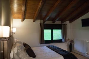Cama o camas de una habitación en Osabarena Hotela