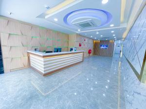 a lobby with a reception desk in a building at Astar Hotel Kuala Lumpur in Kuala Lumpur