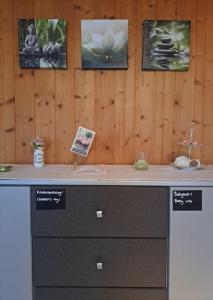 a counter in a room with pictures on the wall at Family-friendly apartment with Alpine view in Matten