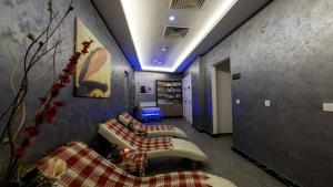 a hallway with two couches in a room at Mai İnci Otel in Antalya