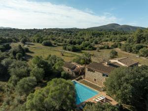 an aerial view of a house with a swimming pool at Son Pastor in Artá