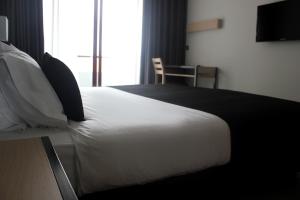 Postel nebo postele na pokoji v ubytování Hotel M