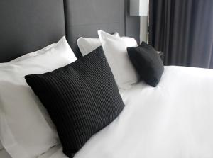 Postel nebo postele na pokoji v ubytování Hotel M