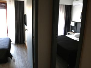 Postel nebo postele na pokoji v ubytování Hotel M