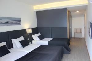 Postel nebo postele na pokoji v ubytování Hotel M