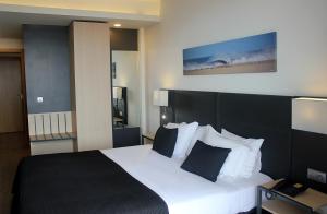 Postel nebo postele na pokoji v ubytování Hotel M + 26 fotografií