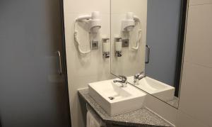 Koupelna v ubytování Hotel M
