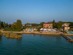 an aerial view of a river with houses and buildings at Villa Pioppi Hotel in Sirmione