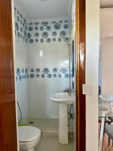 a bathroom with a toilet and a sink at Cidade Velha - Cathedral and Sea view - 2Bdr Apart - 3 in Cidade Velha