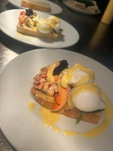 a plate of food with an egg on top at The Fishmongers Tavern in Sheringham