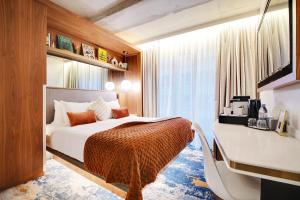 Posteľ alebo postele v izbe v ubytovaní CARD Hôtel