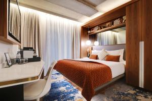 Posteľ alebo postele v izbe v ubytovaní CARD Hôtel