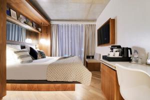 Posteľ alebo postele v izbe v ubytovaní CARD Hôtel