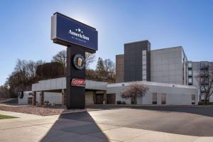 a building with a sign in front of it at AmericInn by Wyndham Rochester Near Mayo Clinic in Rochester