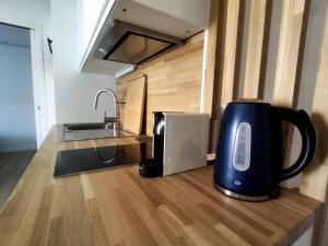 Dapur atau dapur kecil di Très bel appartement à 2 minutes de la plage de Tanchet - 4 pers