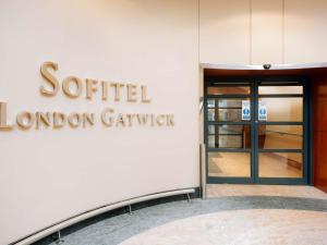 a sign for the southern london library on the side of a building at Sofitel London Gatwick in Horley