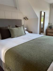 a bedroom with a large bed and a window at Falmouth Bay in Falmouth