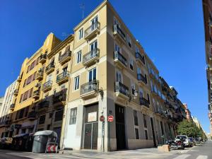 a tall building on the corner of a street at Flats Friends Torres Quart in Valencia