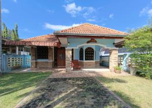 a small house with a tile roof at Forever House in Koh Mook