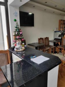 a kitchen with a christmas tree on a counter at Motel BI in Bijeljina