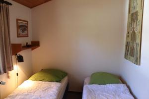 Säng eller sängar i ett rum på Ferienhaus Robinson Romantikpfad 162