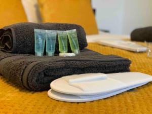 a towel with three glasses on top of it on a table at The Hughenden Townhouse / Free Parking / Wifi in Leicester
