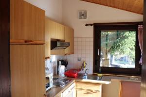 a small kitchen with a sink and a window at Ferienhaus Scout Paradiesecke 179 in Waldbrunn