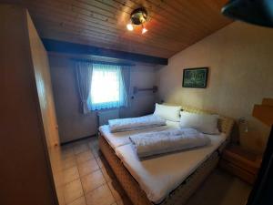 Postel nebo postele na pokoji v ubytování Ferienhaus Robinson Romantikpfad 164 + 15 fotografií