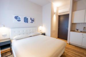 Postel nebo postele na pokoji v ubytování Palmanova Suites