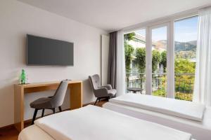 TV/trung tâm giải trí tại Vienna House by Wyndham Martinspark Dornbirn