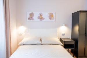 Postel nebo postele na pokoji v ubytování Palmanova Suites
