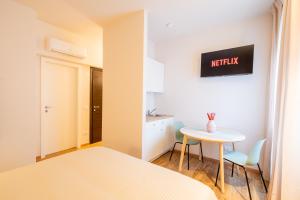 Postel nebo postele na pokoji v ubytování Palmanova Suites
