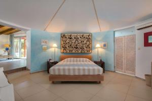 Ein Bett oder Betten in einem Zimmer der Unterkunft Dionysos Hotel