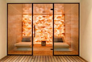 a glass door with two beds in a room at Rixos Premium Dubrovnik in Dubrovnik