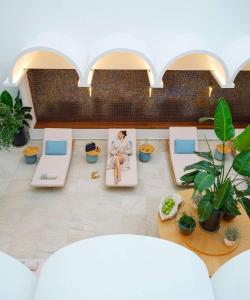 an overhead view of a living room with couches and plants at Rixos Premium Dubrovnik in Dubrovnik