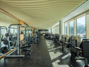 a gym with a row of treadmills and machines at Rixos Premium Dubrovnik in Dubrovnik