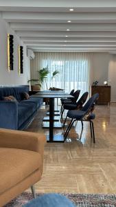 a living room with a table and some chairs at Misk Villa - Boutique Hotel & Spa in Sidi Bou Saïd
