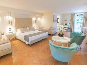 Postel nebo postele na pokoji v ubytování Hotel Villa Cariola