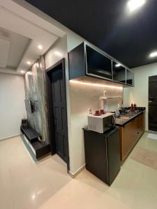 Virtuvė arba virtuvėlė apgyvendinimo įstaigoje Apto Moderno - Centro
