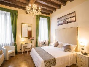 Postel nebo postele na pokoji v ubytování Hotel Villa Cariola