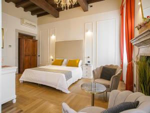 Postel nebo postele na pokoji v ubytování Hotel Villa Cariola