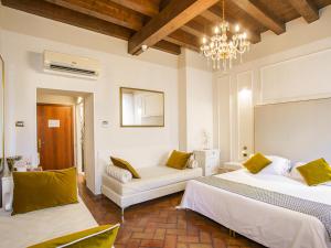 Postel nebo postele na pokoji v ubytování Hotel Villa Cariola