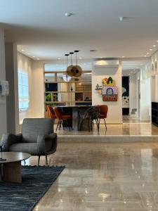 a living room with a couch and a table at Misk Villa - Boutique Hotel & Spa in Sidi Bou Saïd