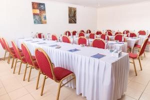 a row of tables and chairs in a room at The Stand Leisure Hotel in Nairobi